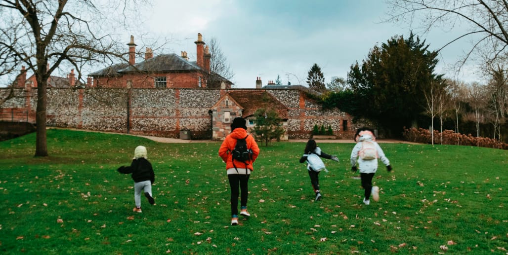 A Family's Fresh Start (Photo of a family running in Caversham Court Park)